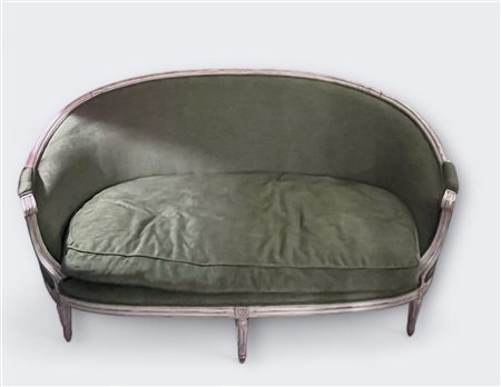 A white lacquered Louis XV style sofa, re-upholstered in modern green fabric....