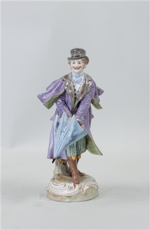 A painted porcelain figure of a gentleman in a storm with an umbrella, marked...