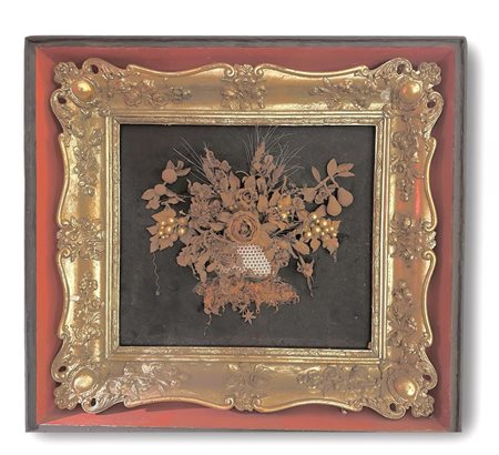 A Biedermeier (dried bouquet) in a gilded wooden frame. Around it a tray...