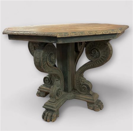 A Neo-Renaissance style table on claw feet with remains of green polychrome,...