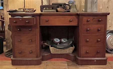 An English, mahogany ladies' desk, the top inlaid with green leather. One...