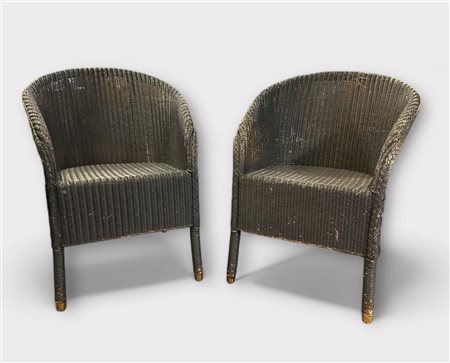 A set of (2) blue lacquered Lloyd Loom armchairs. Marked: W. Lusty & Sons,...