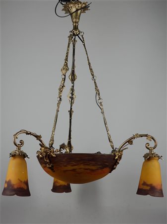 An Art Nouveau brass three-armed pendant lamp with multi-coloured glass...