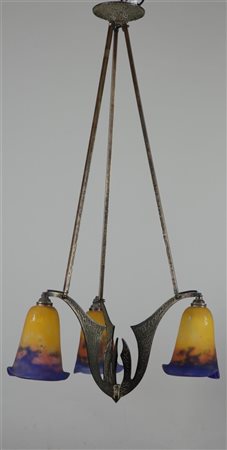 An Art Nouveau brass pendant lamp with multi-coloured glass shades. L. 80 cm.