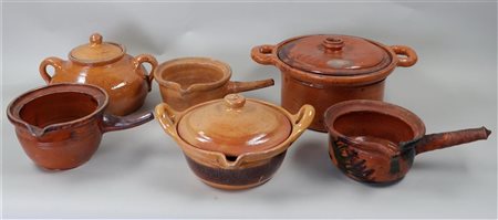 A collection of (6)(slip)-earthenware objects. Including cooking pots and...