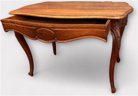 A walnut, Louis XV style, scalloped desk top with one drawer, 19th century....