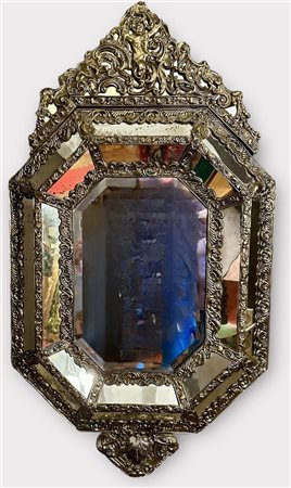 A 19th century "Venetian" octagonal pressed copper wall mirror with Jupiter...