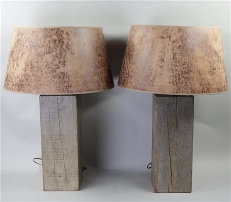 Two decorative table lamps mounted on teak bases. H. 69 cm.