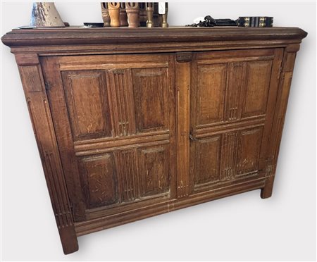 An oak, two-door sideboard, ca. 1800. 113 x 48 x 146 cm. NB: The objects on...