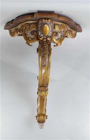 A partly gilded Louis XV style wall console, hanging model. H.: 68 cm.