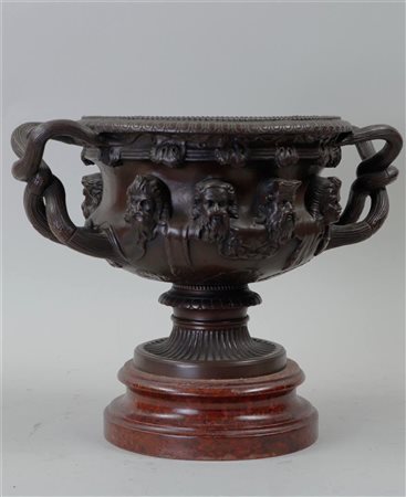 A bronze pipe stove. Grand Tour model of the Warwick vase, 19th century.