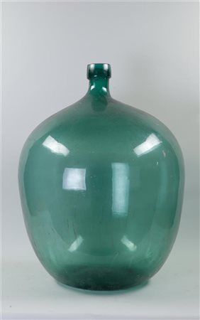 A very large green glass wine bottle. France, 19th century. H. 60 cm.