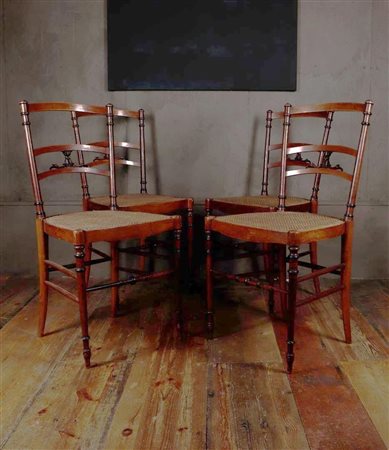 A set of (4) early Arts & Crafts chairs with wicker seat. Seat height 42.5...