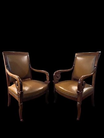 A pair of Charles X armchairs upholstered in mocha leather. France, 18th...