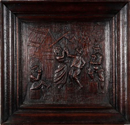 An 18th century carved oak panel depicting figures partying at an inn, in an...