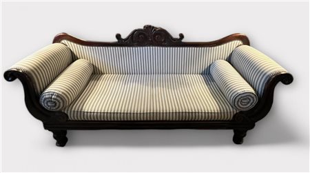 A Regency sofa upholstered in striped, light blue fabric. Bolster cushions on...