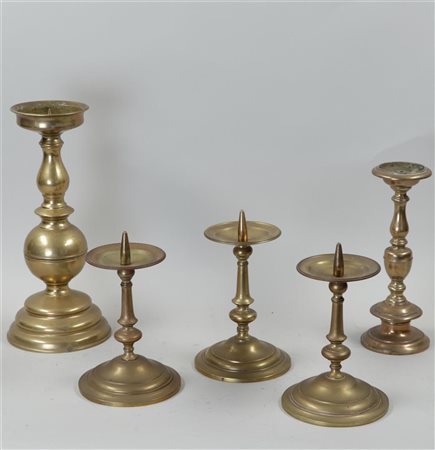 A lot of five yellow copper pen candlesticks. Circa 1800.