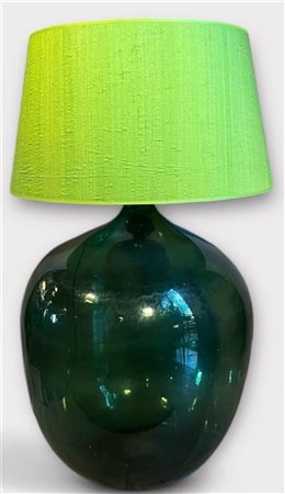 A very large green glass wine bottle turned into a table lamp. France, 19th...