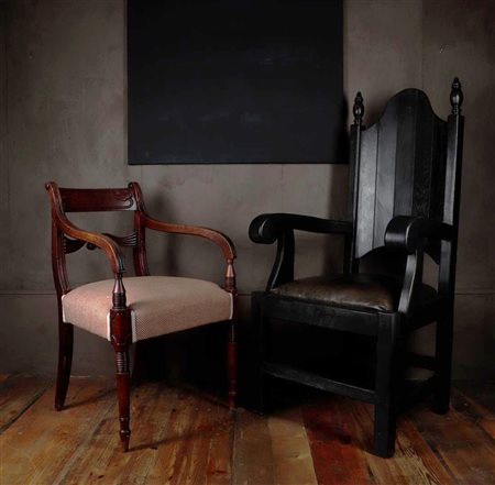 A dark stained armchair in Gothic style. An early 19th century armchair....