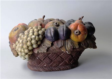 A plaster polychrome table piece in the shape of a fruit basket. 20 x 30 cm.