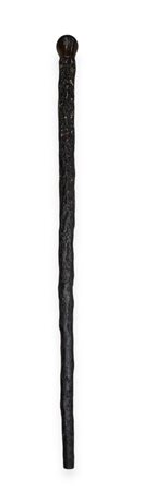 A walking stick made from a tree root with a walnut knob. L. 90 cm.