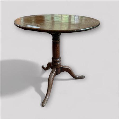 A late 18th century oak side table or port table on one leg with three feet....