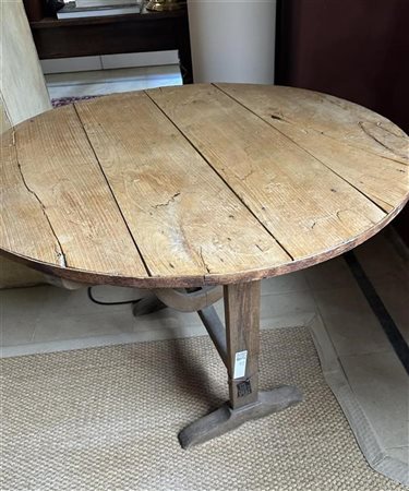 A rough wooden, round vineyard table. France, ca. 1900. Height 71 cm. Diam....