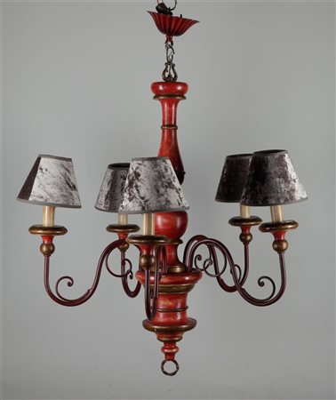 A red lacquered wooden lamp.