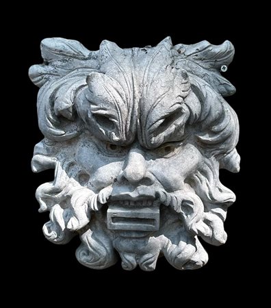 A grotesque cast in lead. The mouth can serve as a gargoyle. 31 x 31 cm.