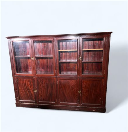 A stained wooden shallow bookcase with brass locks. 20th century. 150 x 125 x...