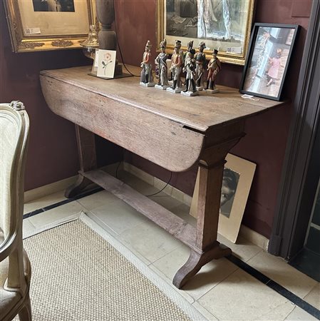 A rough wooden side table with foldaway top parts. 19th century. 85 x 140 x...