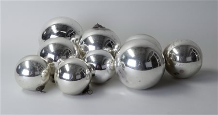 A lot consisting of (9) antique silver glass witches balls. The largest is 14...