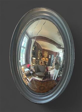 A large, grey lacquered oval butler mirror, 19th century. Mirror cracked. 95...