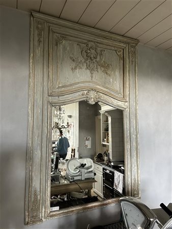 A partly gilded, Louis XVI, ornamented wall or mantel mirror. 185 x 110 cm.