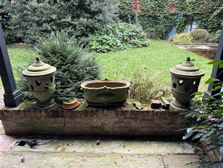 A three-piece set of two lanterns and a jardiniere. The jardiniere is from...