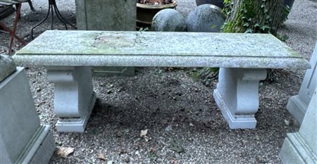 A stone garden bench. 44 x 128 x 28 cm.