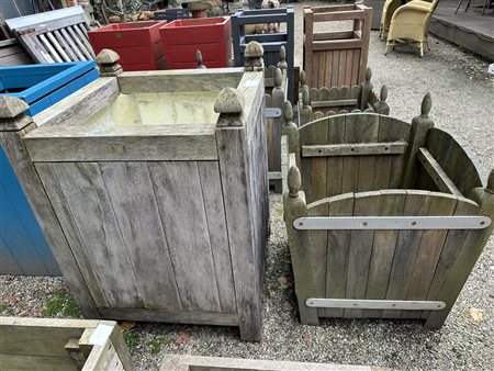 A lot of (2) greyed teak planters. One straight, and one tapered planter. The...