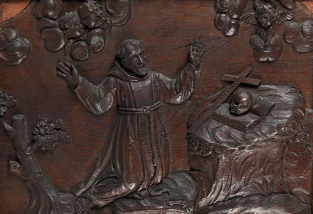 San Francesco il santo è raffigurato in ginocchio, davanti a lui un teschio...