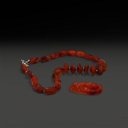 A carnelian pendant and necklace