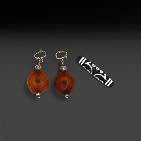 A Tibetan Dzi and two earrings