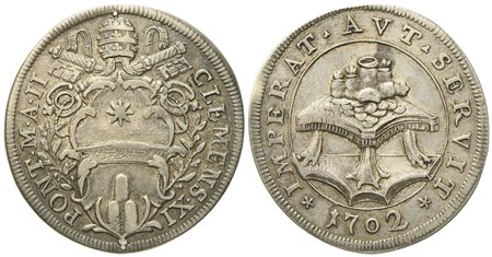 STATO PONTIFICIO. Roma. Clemente XI (1700 - 1721). Testone 1702 "Tavolo con monete". Ag (9,04 g; 32,2 mm)