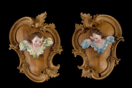 Pair of wooden cherubs