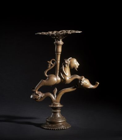 A zoomorphic bronze candle stand