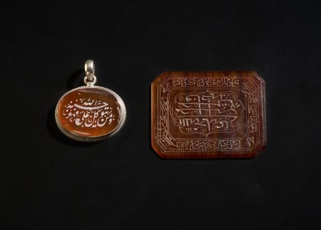 Two engraved carnelian plaques (aqiq)