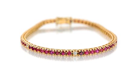 Bracciale tennis in oro, rubini e brillanti Oro rosa 750/000. Rubini naturali...