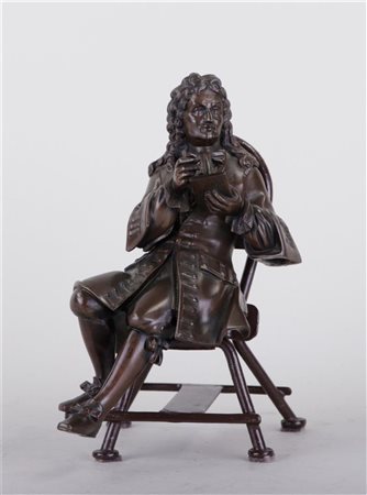 A decorative patinated bronze statue of a French writer in 18th century...