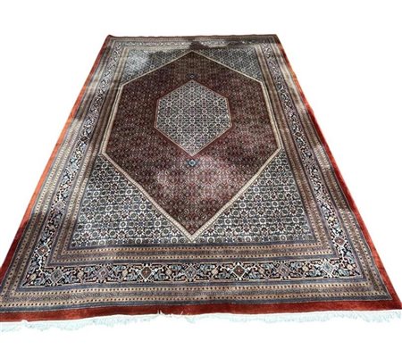 A large Persian carpet.350 x 250 cm.