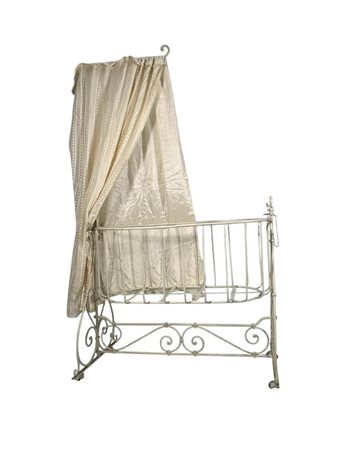 A white-painted iron cradle, ca. 1930/1940.