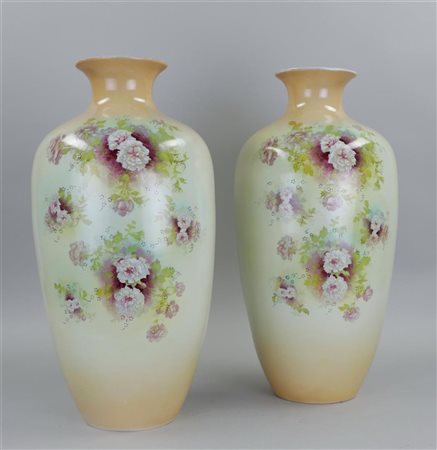 A set of two large earthenware vases decorated with flowers. England, circa...