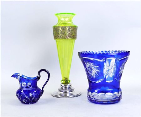 A lot consisting of a cut blue vase, a matching pouring jug, and a green...